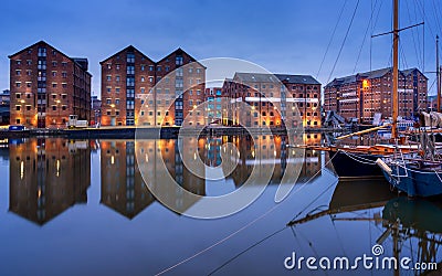 Gloucester docks and sail boats reflected in quay on Sharpness canal Stock Photo