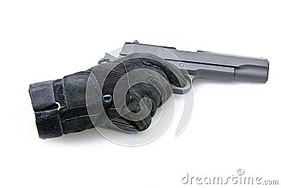 Glove holding gun Stock Photo