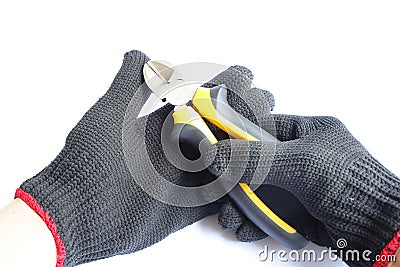 Gloved hand and cutting pliers Stock Photo