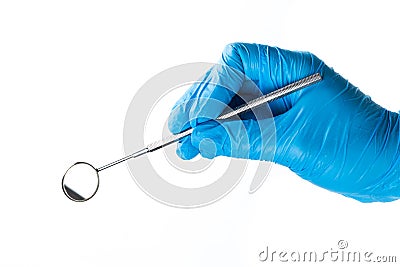 Gloved hand with dental instrument Stock Photo