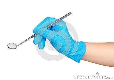 Gloved hand holding angled mirror Stock Photo