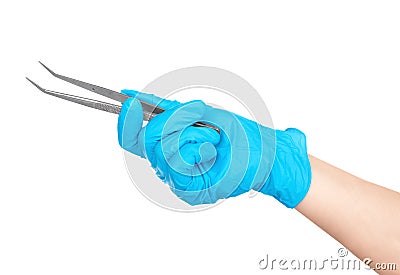 Gloved hand holding a medical tweezers Stock Photo