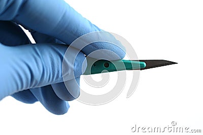 Gloved hand holding scalpel Stock Photo