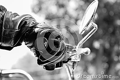 Gloved hand on motorcycle Stock Photo