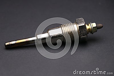 Glow plugs for diesel engine on dark background. Glow plug which is spare part for automobiles. Single type glow plug Stock Photo
