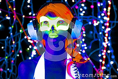 Glow uv neon disco female cyber doll Stock Photo