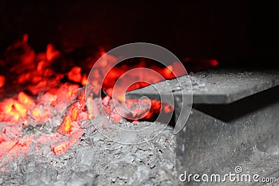 Glowing carbon in wooden stove Stock Photo