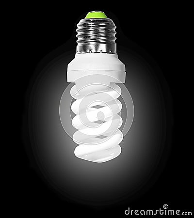 Glowing compact fluorescent light bulb with spiral tube on a black Stock Photo