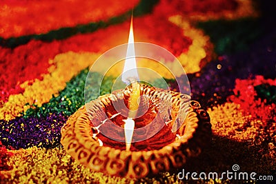 Rangoli with glowing diya Stock Photo