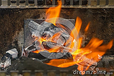 Glowing and flaming fire on barbecue coal stove Stock Photo