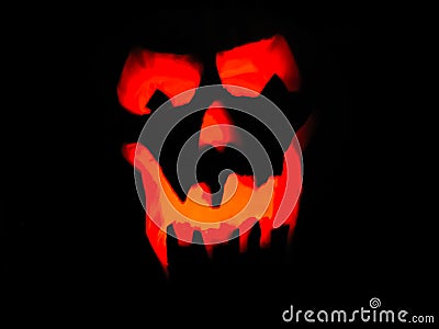 Glowing Ghoulish Pumpkin Grin Stock Photo