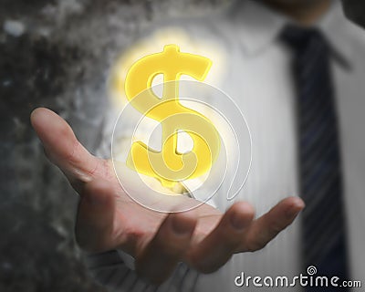 Glowing golden dollar sign in man's hand Stock Photo