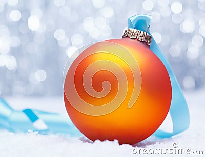 Glowing golden orange Xmas bauble Stock Photo