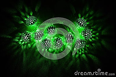 Glowing green lights on dark background Stock Photo