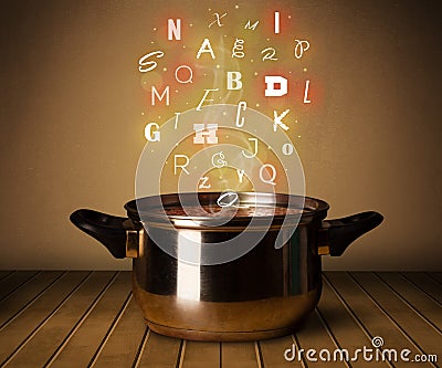 Glowing letters coming out from cooking pot Stock Photo