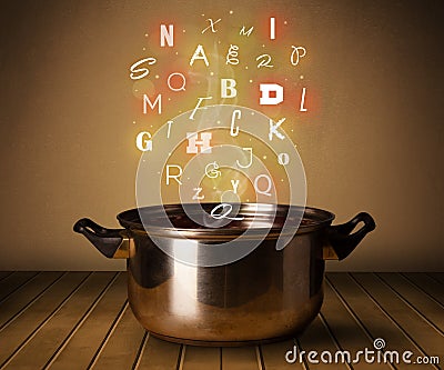 Glowing letters coming out from cooking pot Stock Photo