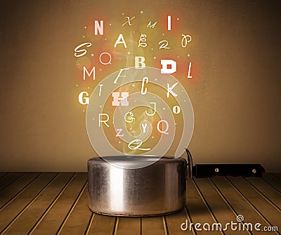 Glowing letters coming out from cooking pot Stock Photo