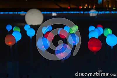 Glowing multi-colored balls, a festive decoration of the city Stock Photo