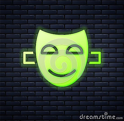 Glowing neon Comedy theatrical mask icon isolated on brick wall background. Vector Vector Illustration