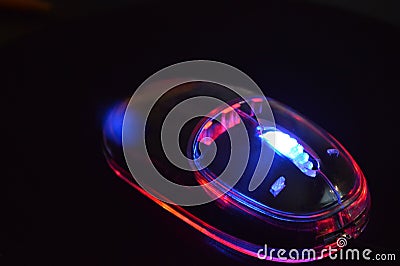 Glowing neon computer mouse Stock Photo