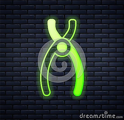 Glowing neon Dental pliers icon isolated on brick wall background. Dental equipment. Vector Vector Illustration