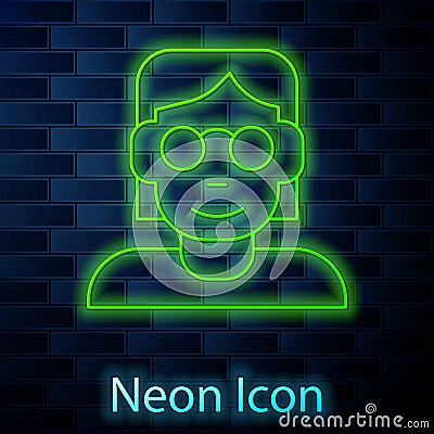 Glowing neon line Hacker or coder icon isolated on brick wall background. Programmer developer working on code, coding Vector Illustration