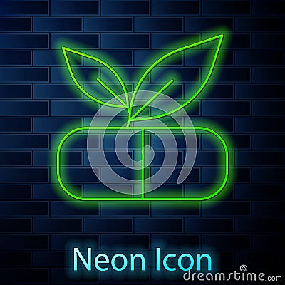 Glowing neon line Medical pill with plant icon isolated on brick wall background. Herbal pill. Vector Vector Illustration