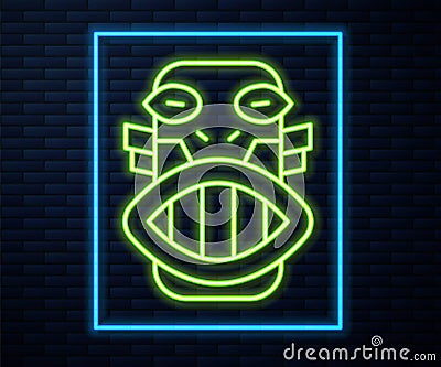 Glowing neon line Mexican mayan or aztec mask icon isolated on brick wall background. Vector Vector Illustration