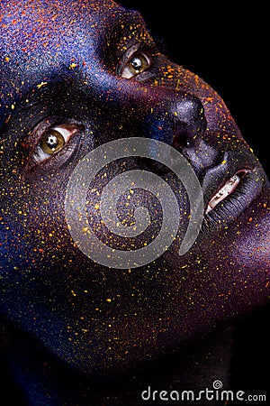 Glowing neon makeup with dramatic look in his eyes. Stock Photo