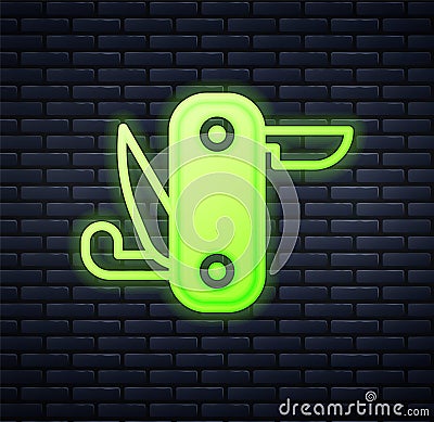 Glowing neon Swiss army knife icon isolated on brick wall background. Multi-tool, multipurpose penknife. Multifunctional Stock Photo