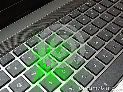 Glowing recycle button on computer keyboard Stock Photo