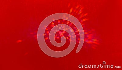 Glowing red spots of flickering bokeh light floating hypnotically with lens flare on bright red background, lights movement Stock Photo