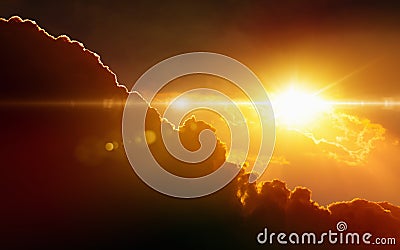 Glowing sunset, dark red clouds, bright sun rays Stock Photo