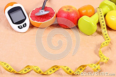 Glucose meter, stethoscope, centimeter and fresh fruits, diabetes, healthy lifestyles concept Stock Photo