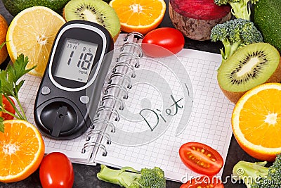 Glucometer with result of sugar level, fruits with vegetables and notepad with word diet. Healthy food for diabetic concept Stock Photo