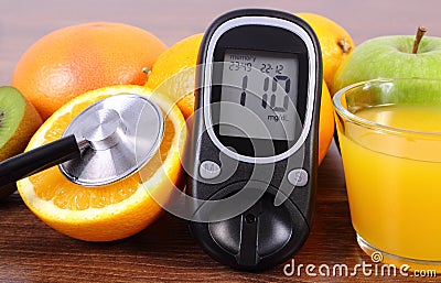 Glucometer, stethoscope, fruits and juice, diabetes, healthy lifestyles and nutrition Stock Photo