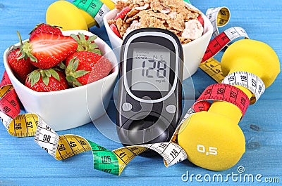 Glucometer with sugar level, healthy food, dumbbells and centimeter, diabetes, healthy and sporty lifestyle Stock Photo