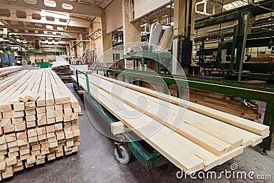 Glued pine timber beams in woodworking factory Editorial Stock Photo