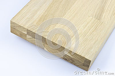 Glued wood structure. Lumber industrial wood texture, timber butts background. Butt end of a processed wooden beam. Stock Photo