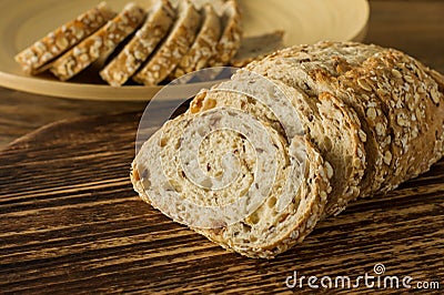 Gluten-free vegan bread and no animal products. Vegetarian bread with oatmeal, banana flavor, on a wooden rustic table, sliced and Stock Photo