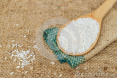 Glutinous rice in wooden spoon Stock Photo