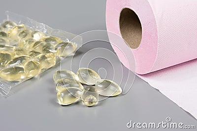 Glycerin suppositories and toilet paper roll Stock Photo