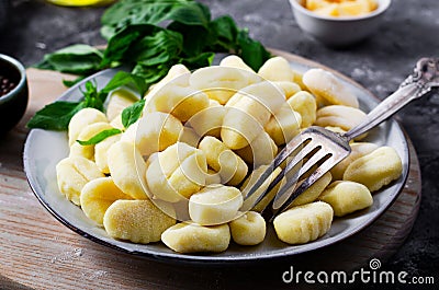 Gnocchi, Fresh Uncooked Potato Gnocchi on Wooden Board, Italian Cuisine Stock Photo