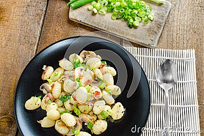 Gnocchi pasta with ham, spring onion Stock Photo