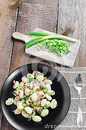 Gnocchi pasta with ham, spring onion Stock Photo