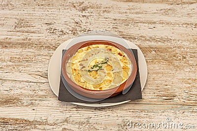 Gnocchis of mashed potatoes cooked with nutmeg and four cheeses Stock Photo
