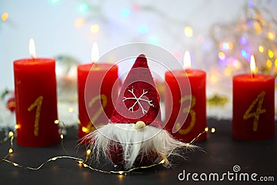 Gnom with 4 candles on a red background Stock Photo