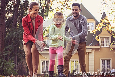 Go run girl. Parents have play with little girl. Stock Photo