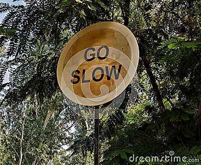 Go Slow traffic sign in a residential area Stock Photo