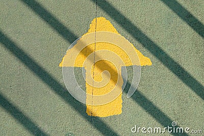 Go straight yellow arrow on asphalt street Stock Photo